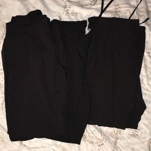 Three pair of black scrubs pants